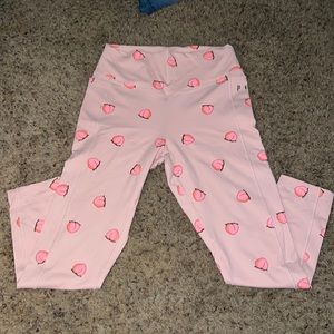 pink leggings with peach’s on them